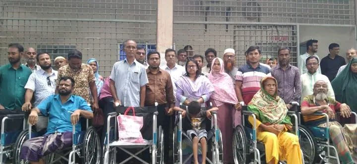 কালাইয়ে প্রতিবন্ধীদের মাঝে হুইল চেয়ার বিতরণ